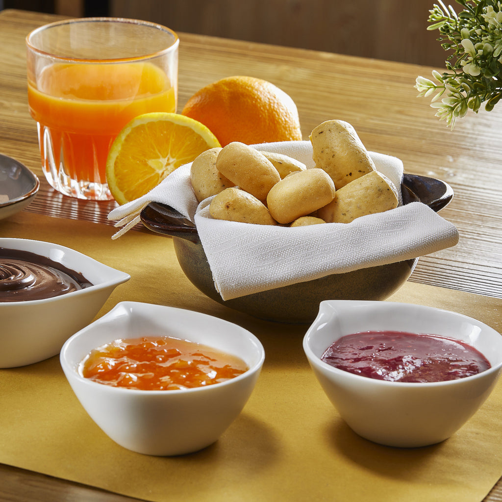 Bowl of Imacoritti Grissini Bites mini breadsticks served with jam and chocolate dips